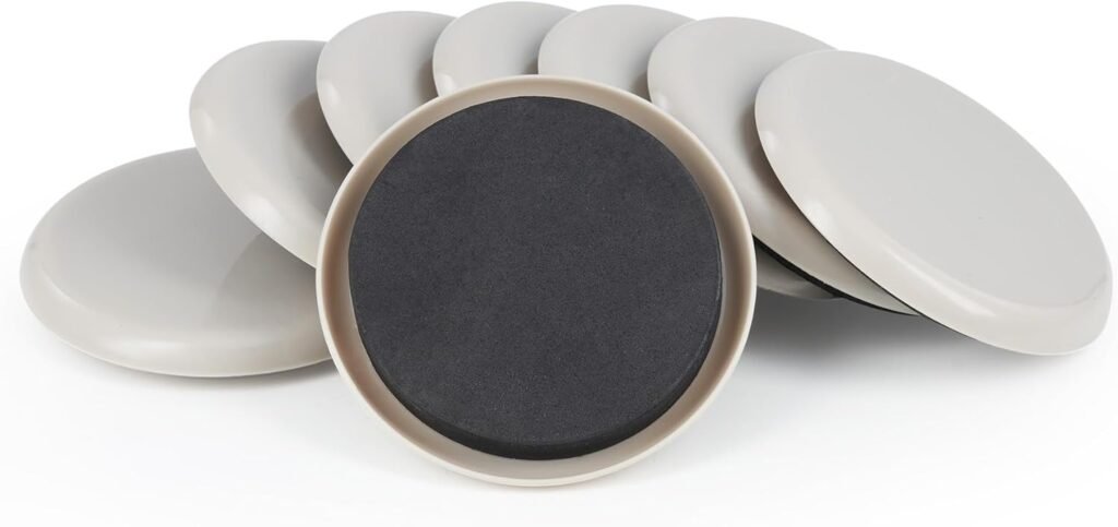 Eight round, light gray discs, arranged with one flipped to reveal its dark surface, on a white background.