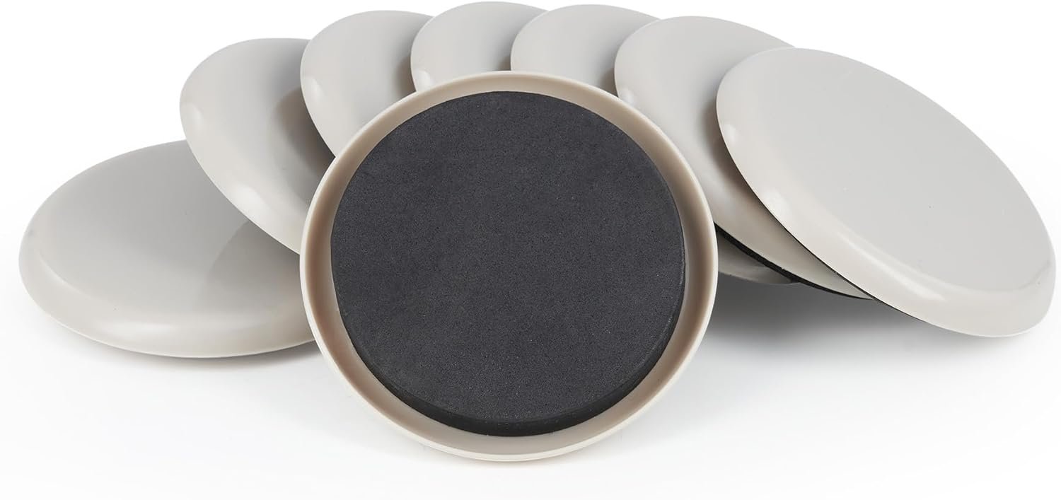 Eight round, light gray discs, arranged with one flipped to reveal its dark surface, on a white background.